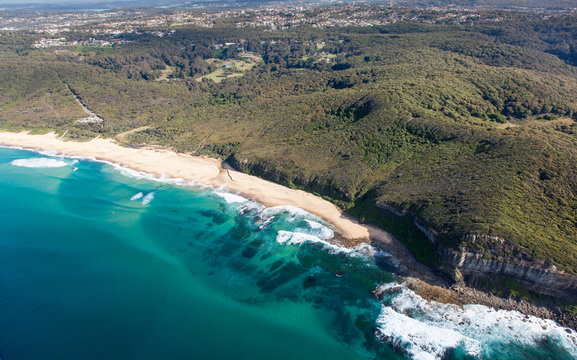 Aerial view of Dudley Beach - Newcastle Australia. This beach is surrounded by state park and is a popular beach for local surfers and beach goers.