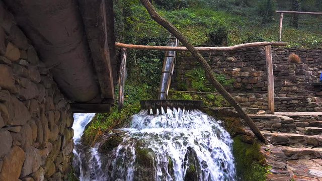 Working watermill wheel with falling water, Etara, Bulgaria