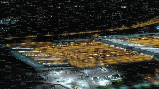 Timelapse of Vehicles Arriving and Departing a Motorail Terminal at Night