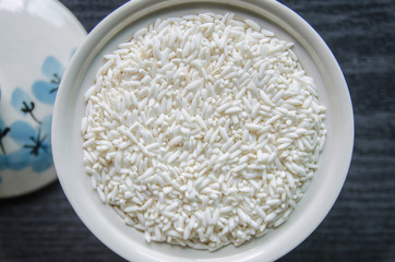 Background and wallpaper by pile of paddy rice and rice seed.