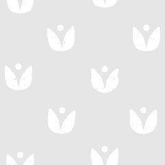 Fototapeta na wymiar Block print seamless pattern with floral motif. White flowers on light grey background