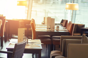 Interior of a cozy cafe. Table ordered at restaurant.