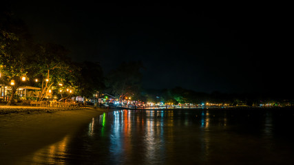 Naklejka na ściany i meble long exposure night image of beach front night life at Wong Duen beach Samed island Rayong district Thailand