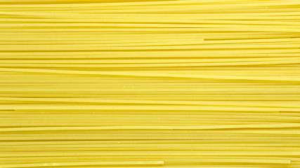 Spaghetti yellow italian pasta line pattern food background concept,Close up.