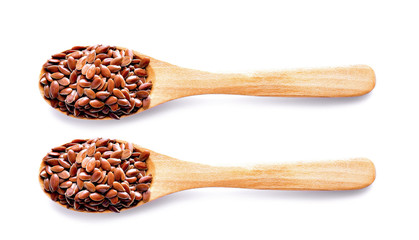 Flax seeds in wood on white background