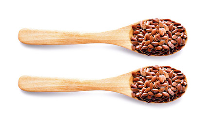 Flax seeds in wood on white background