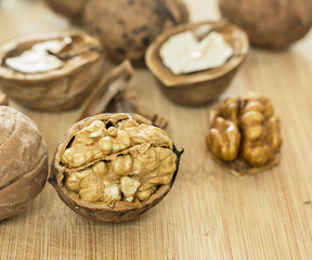 Healthy food safety concept:Walnuts kernels on dark desk with color background