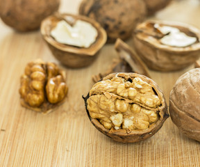 Healthy food safety concept:Walnuts kernels on dark desk with color background