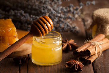 honey dipper and honeycomb. nuts and apples with honey and nuts of various kinds