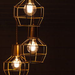 Ceiling chandelier with hanging three bulb lamps