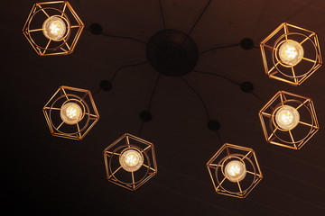 Spider type chandelier with hanging bulb lamps