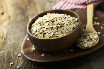 Organic oats in the wooden bowl