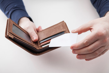 Man in suit with wallet and credit card