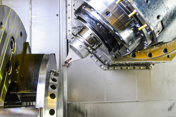 CNC Router and turning metal with a cutting tool and centering tool. The concept of high-tech...