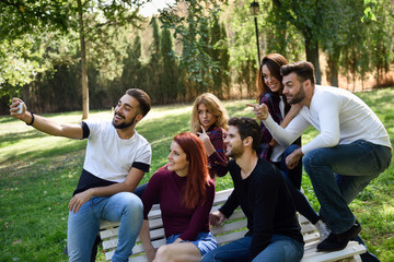 Fototapeta premium Group of friends taking selfie in urban background