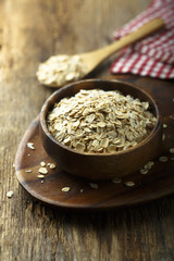 Organic oats in the wooden bowl
