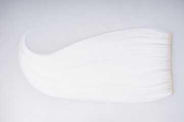 Blond natural hair isolated on white background