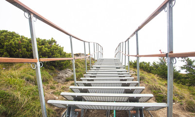 ladder or stairchase in the mountain. white background