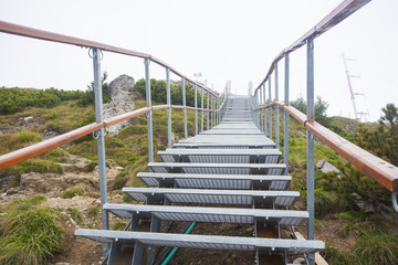ladder or stairchase in the mountain. white background