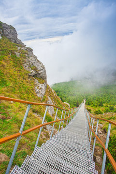 ladder with stairs in the beautiful mountain landscape. Ceahlau, Toaca. Romania