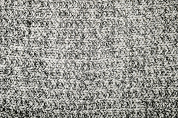 Warm wool gray knitted crumpled plaid. Texture, background.