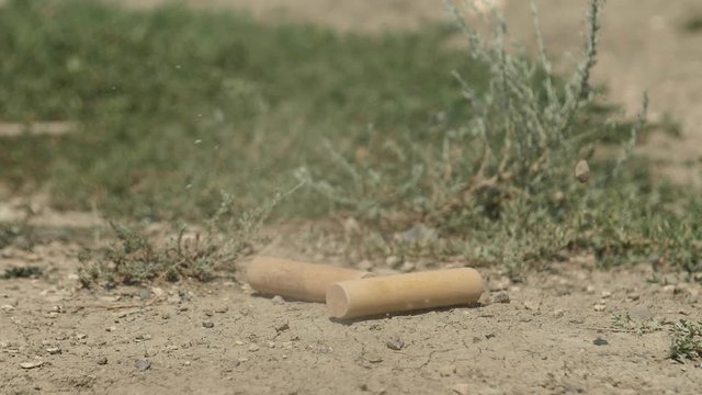 Traditional Russian game GORODKI. Bita knocks down the figure Slow Motion video