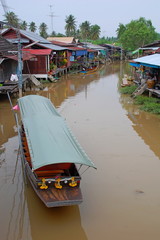 The floating market in Amphawa near Bangkok in Thailand