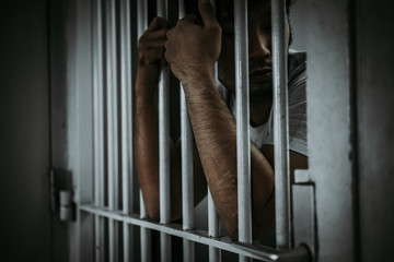 Hands of men desperate to catch the iron prison,prisoner concept,thailand people,Hope to be free.