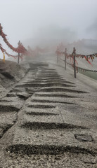 Huashan mountain stairs trail with mist and fog - Xian, Shaaxi Province, China