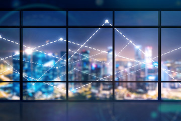 Glowing graphs over night city view, office