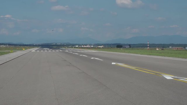 Varese, Italy. Malpensa international airport. Take off runway from the airplane window