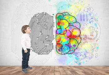 Little boy in jeans and shirt, creative thinking