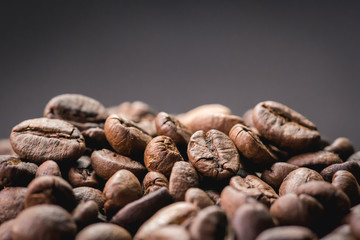 Close up of coffee beans are the background.