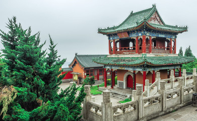 Fototapeta na wymiar Buddhist Temple with colorful decorative details at the top of the Tianmen Mountain, Hunan Province, Zhangjiajie, China