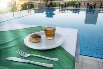 Breakfest by the pool in the summer resort