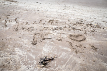 plage écriture sur le sable