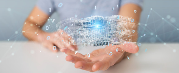 Businessman using wireframe holographic 3D digital projection of an engine