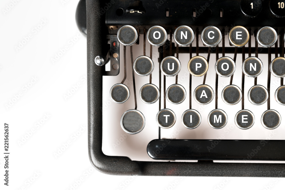 Fototapete close up of retro style typewriter in studio, once upon a time
