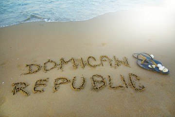 Dominican republic written in the sand. Exotic vacation concept
