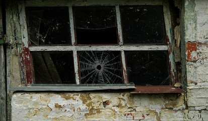 Chernobyl. Broken glass in a old window frame.