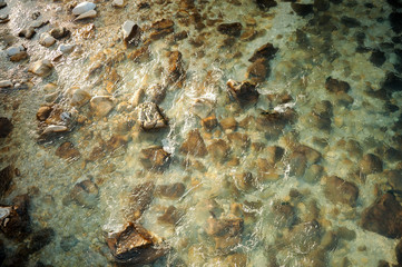Clear mountain river with a lot of stones on its bottom