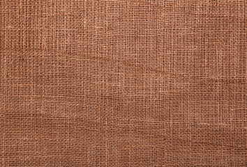 Texture of burlap. Well visible pattern woven threads.