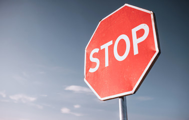 stop sign on background of blue sky