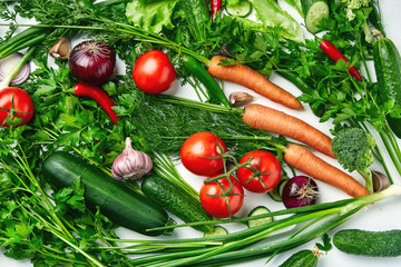 A set of vegetables, tomatoes, zucchini, broccoli, carrots, parsley, onions, cucumber. Fresh natural vegetables.