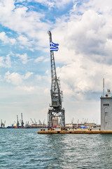 Thessaloniki, Greece - August 16, 2018: Coast of historical cityview with traditional winches at harbour of Thessaloniki, Greece