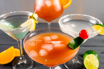 Different kinds of cocktails on the wooden background
