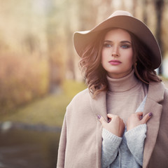 Romantic woman outdoor, portrait. Perfect female model with healthy hair and makeup, face closeup
