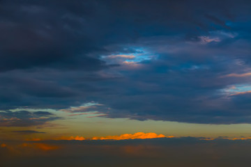 Obraz premium Last ray of the setting sun. Sky covered with dark clouds.