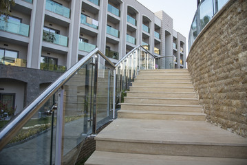 Outdoor stone staircase. Stone steps of old staircase with stainless steel