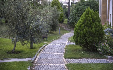 Cobblestone walk in the garden in summer